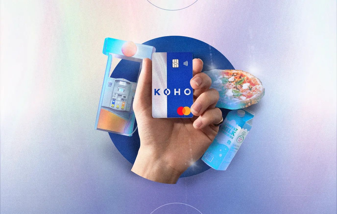 Hand holding KOHO Extra card with surrounded by atm milk and pizza